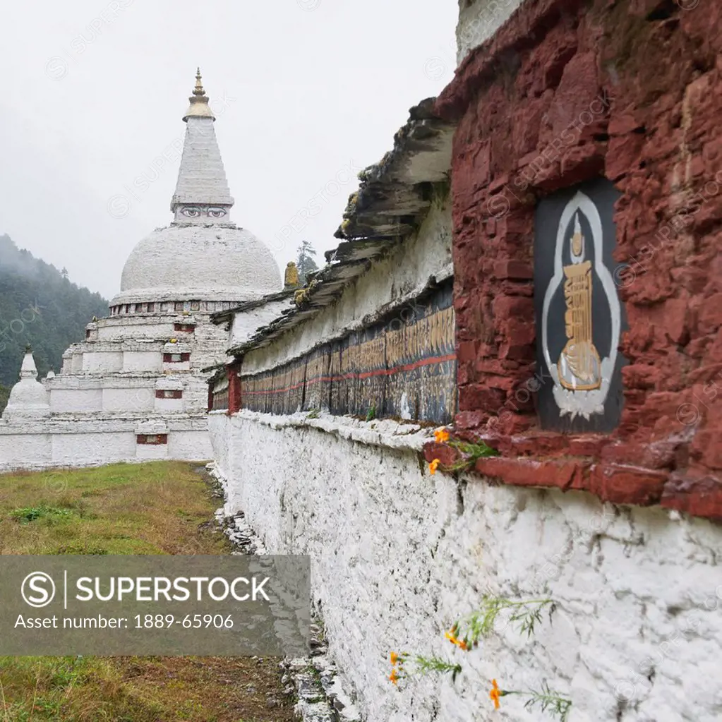 a stone wall and the chendebji chorten, bhutan