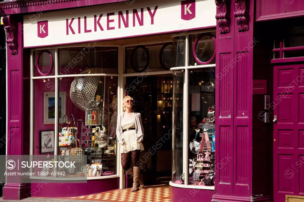 young woman outside store, killarney county kerry ireland
