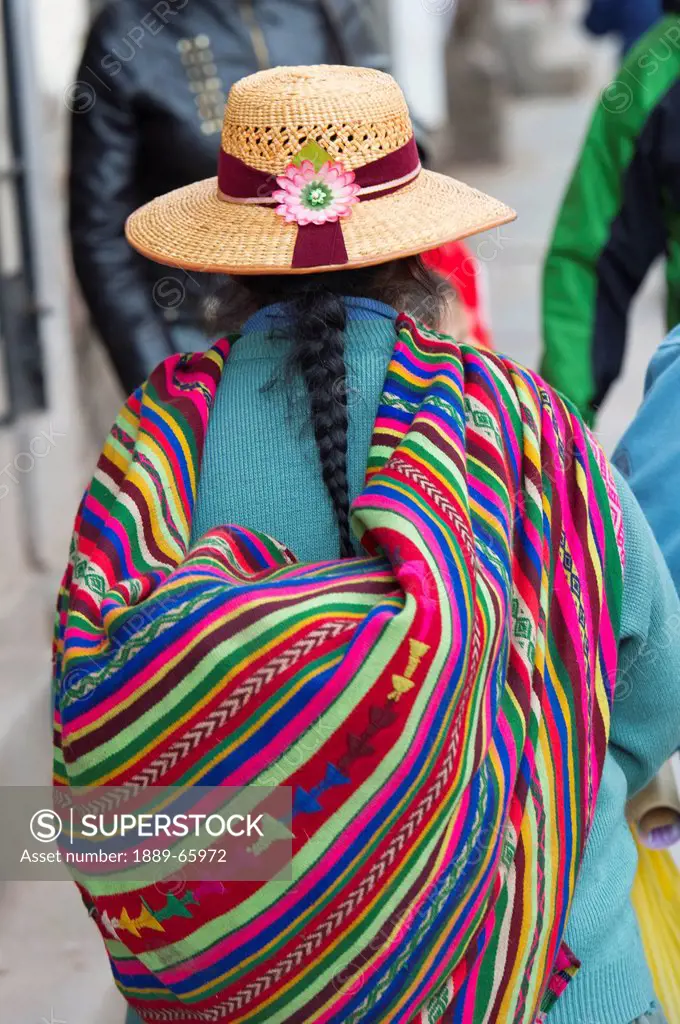 A Woman Carries A Colorful Bundle On Her Back, Cusco Peru