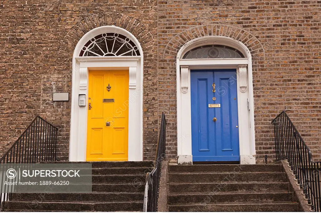 a yellow door and a blue door side by side at the top of the steps, dublin county dublin ireland
