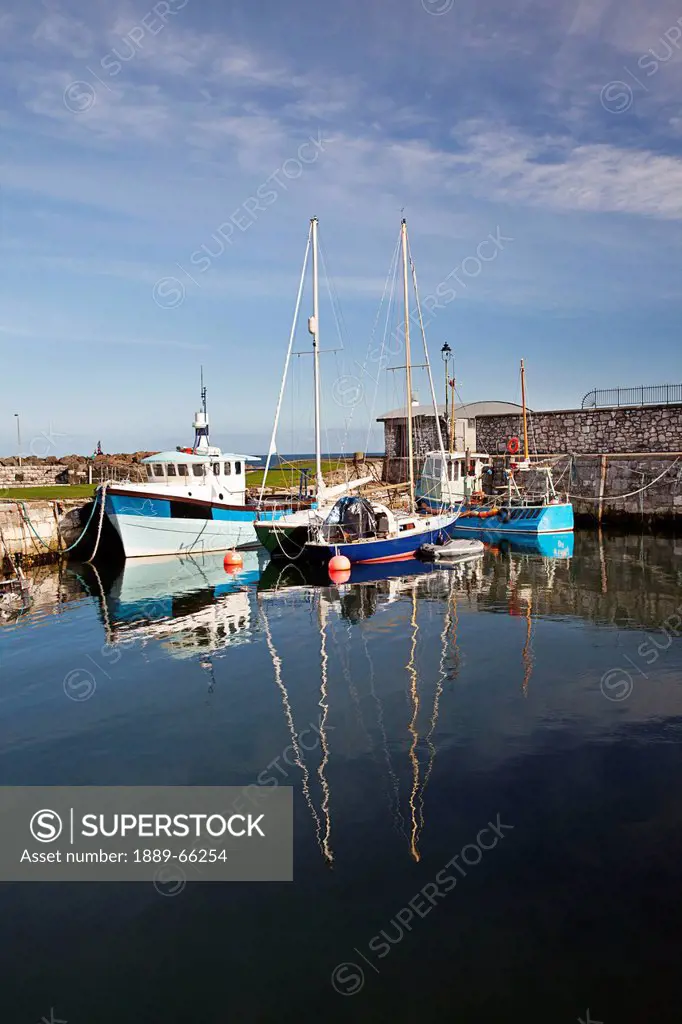 boats in carnlough harbor, county antrim ireland