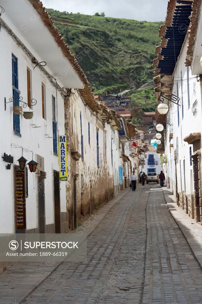 narrow street in barrio de san blas neighborhood, cusco peru