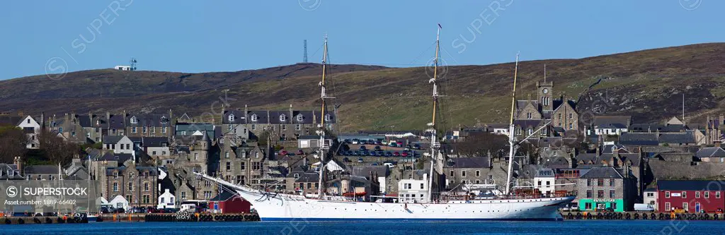 a large ship in the harbor, shetland scotland
