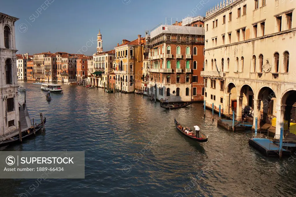 gondola and boat on the grand canal, venice italy