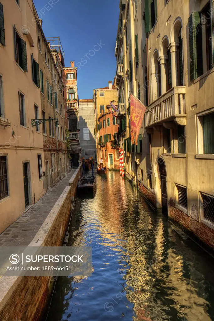 gondola in a canal, venice italy