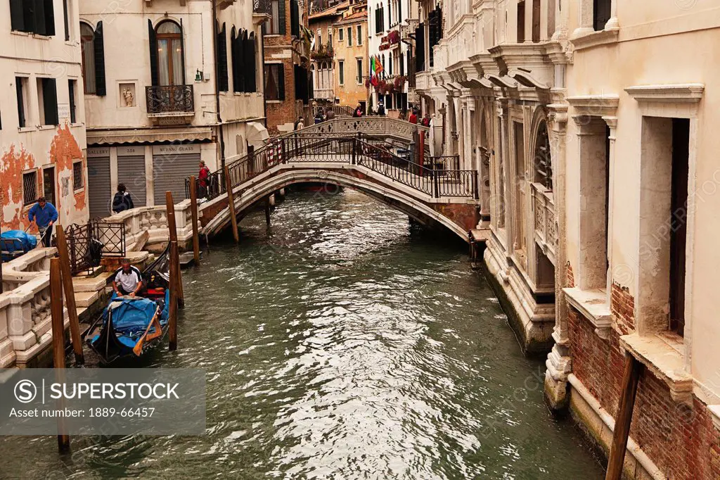 gondola and footbridge over the canal, venice italy
