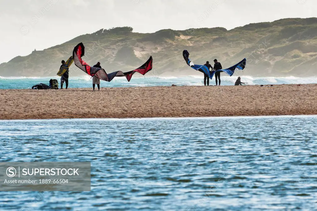 people preparing for kite surfing on punta paloma beach, tarifa cadiz andalusia spain