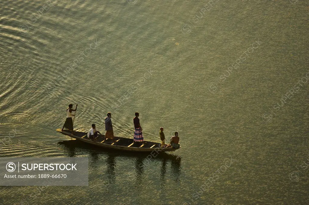 People Standing On A Boat In The Surma River, Sylhet, Bangladesh