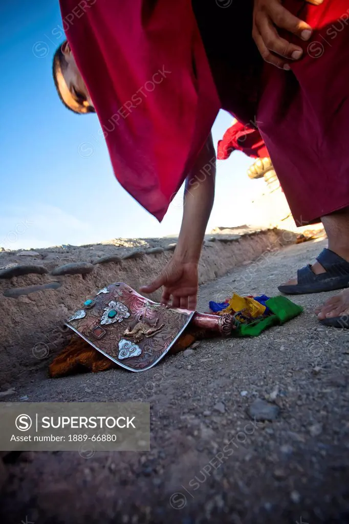 A Ladakhi Monk Reaches For His Ceremonial Conch Shell Horn, Ladakh Jammu And Kashmir India