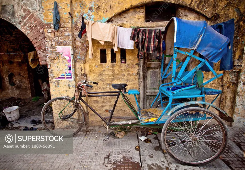 A Blue Cycle Rickshaw Parked Outside A Building, Haridwar India
