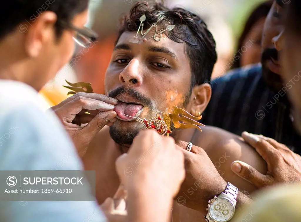 A Young Man In A Ritual Of Tongue Piercing, India