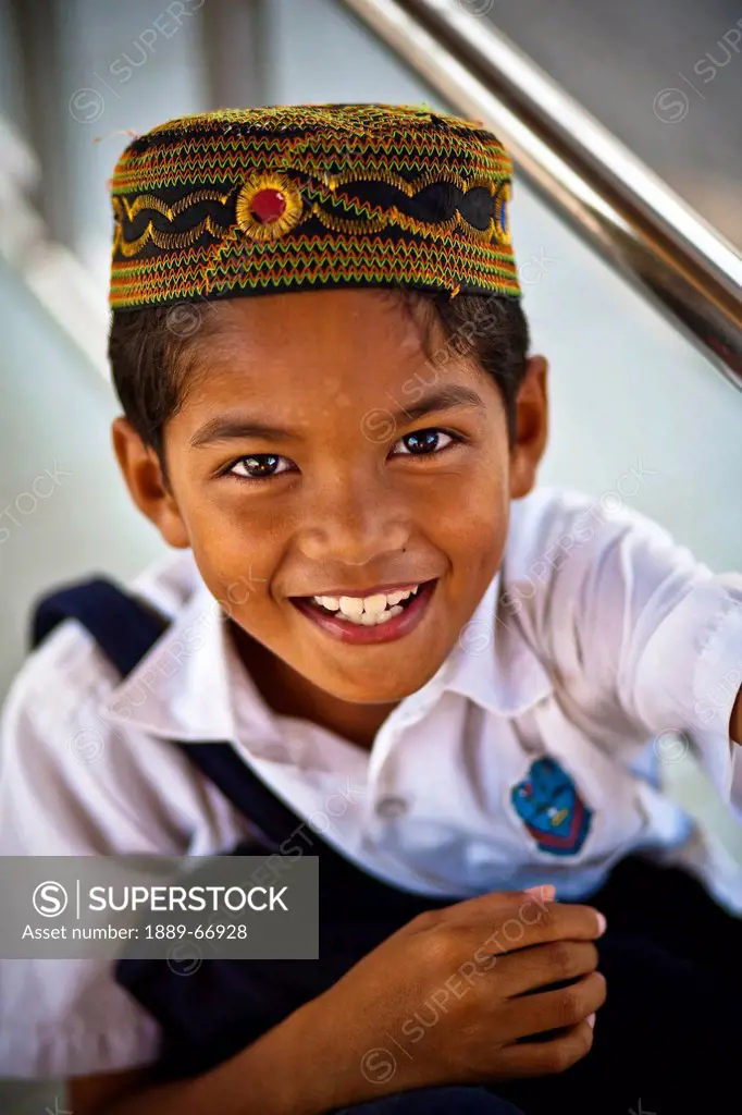 A Muslim School Boy Wearing A Uniform And A Prayer Cap, Pulau Perhentian Malaysia