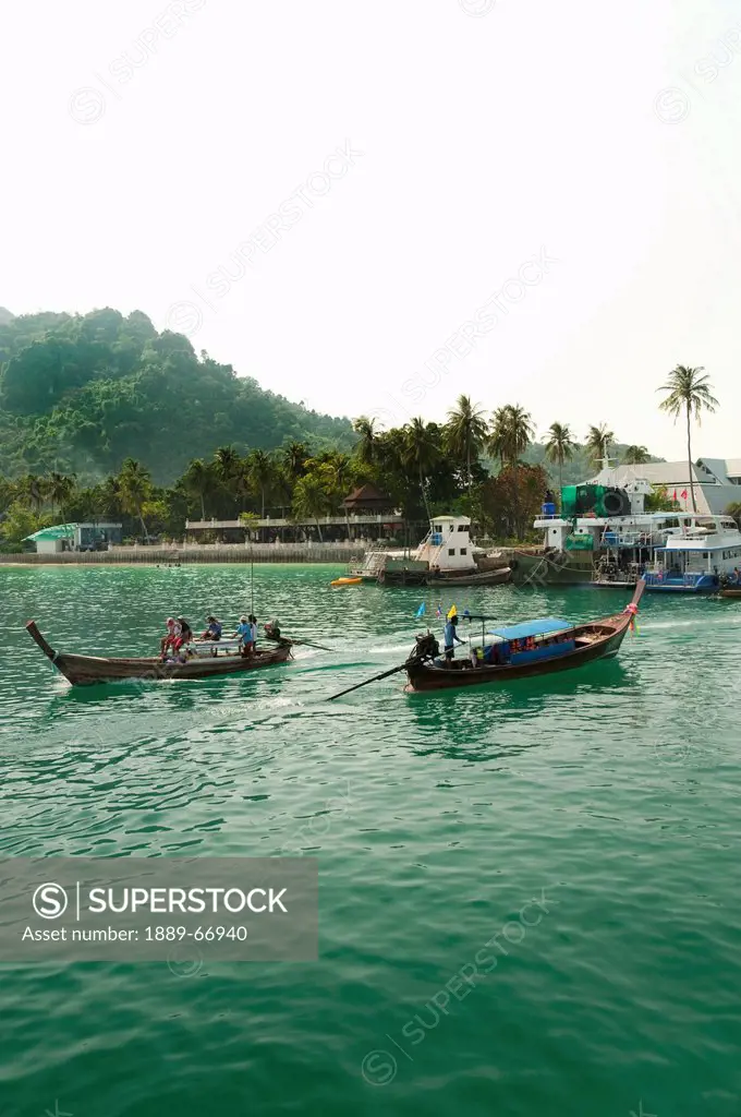 boats at phi phi islands ton sai bay, phuket thailand