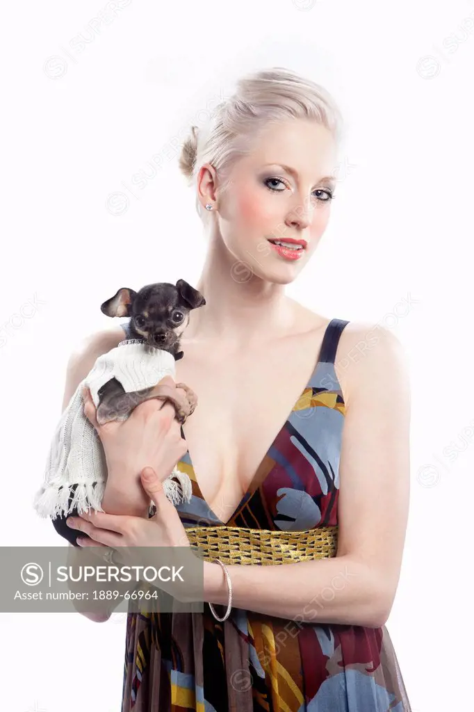 a young woman holds a small dog, edmonton alberta canada
