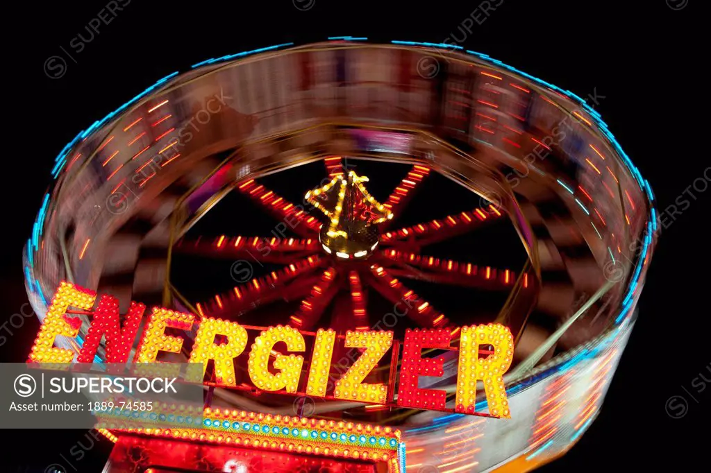 An Amusement Park Ride Called Energizer Illuminated At Night, South Shields Tyne And Wear England