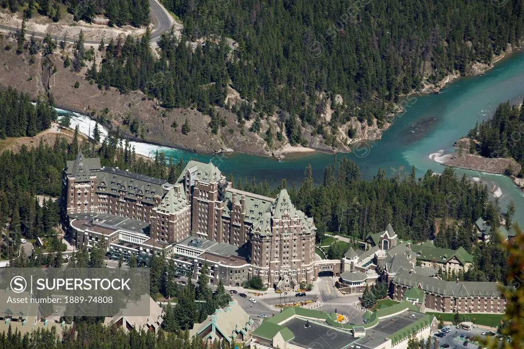 High Angle View Of Banff Springs Hotel With Bow River And Bow Falls In The Background, Banff Alberta Canada