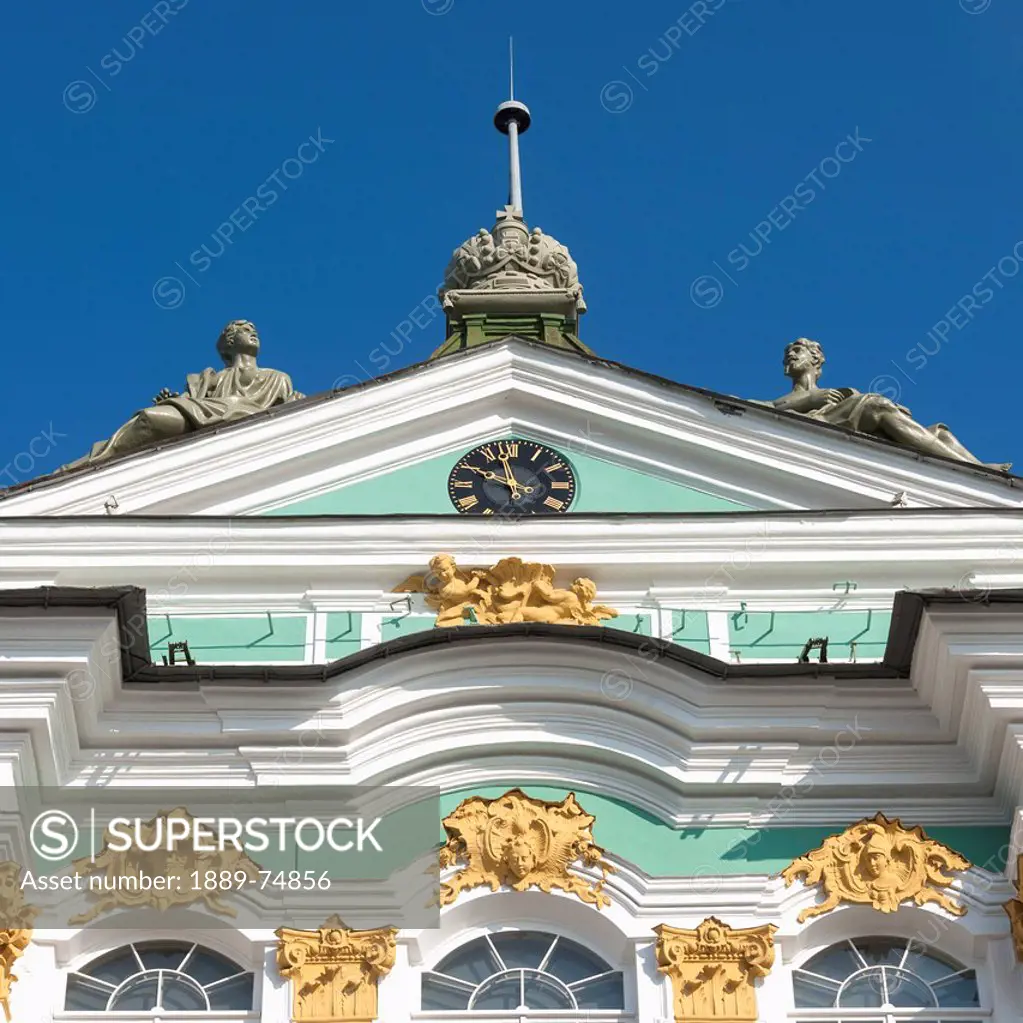 Clock and sculptures on the winter palace, st. petersburg russia