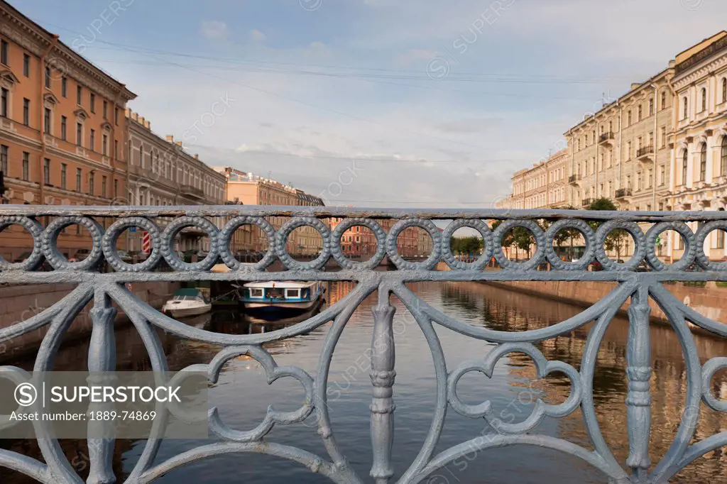 Moyka river through the bridge railing, st. petersburg russia