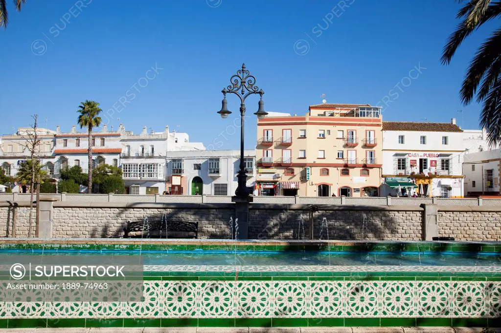 Colourful tile on a water fountain in an urban area, chiclana de la frontera andalusia spain