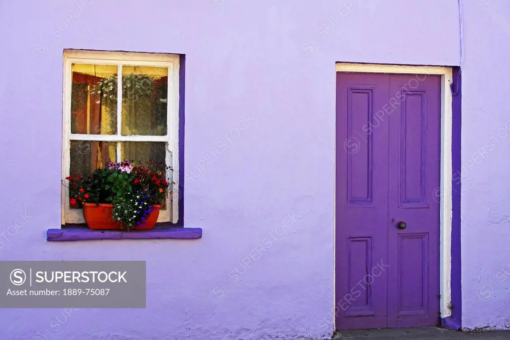 Purple House With Flower Box In Window On The Beara Peninsula In West Cork In Munster Region, Eyeries Village County Cork Ireland