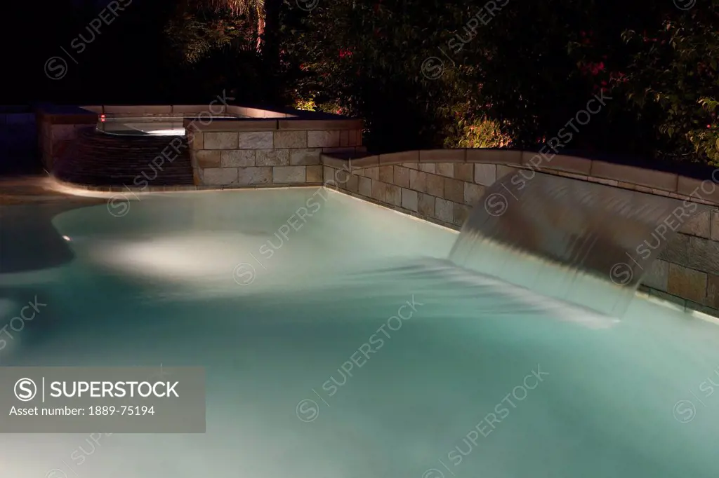 Night Lights In A Swimming Pool With A Waterfall, Palm Springs California United States Of America