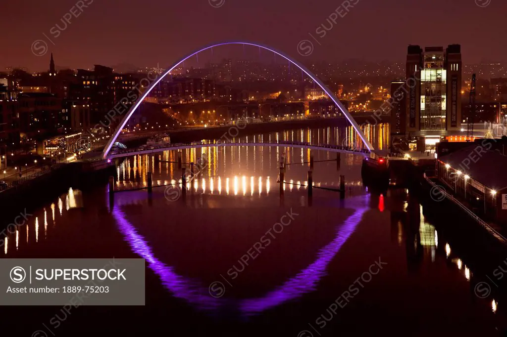 A Glowing Purple Arch On A Bridge Crossing River Tyne Illuminated At Night, Newcastle Northumberland England