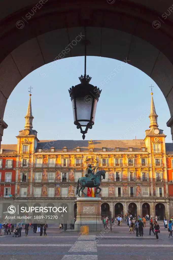 Equestrian Statue Of King Felipe Iii In The Busy Plaza Mayor, Madrid Spain