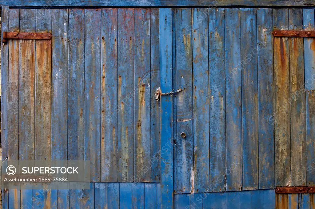 The Side Of A Weathered Building Painted Blue, Argyll Scotland