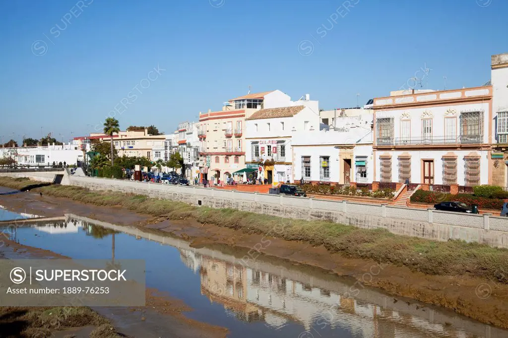 White buildings reflected in the water, chiclana de la frontera andalusia spain