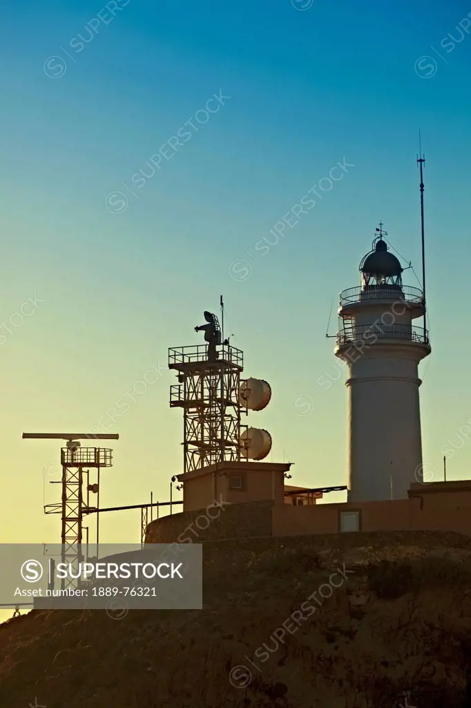 Lighthouse and communications apparatus on the headland in the cabo de gata_nijar natural park, cabo de gata almeria province spain