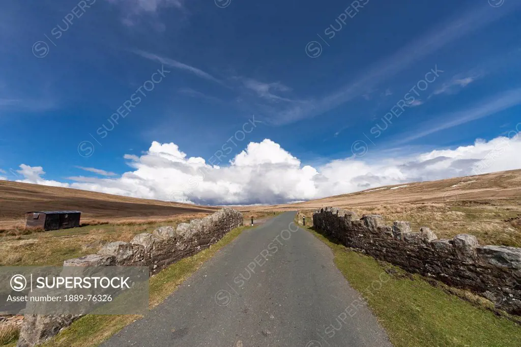 A road lined with a stone wall, swaledale england