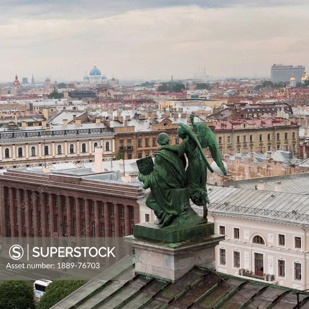 Statue on a rooftop with saint isaac´s cathedral and saint isaac´s square in the distance, st. petersburg russia
