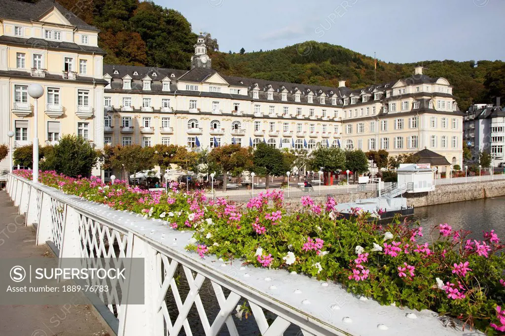 Blossoming flowers in planters along the railing of the promenade along river lahn, bad ems rheinland_pfalz germany