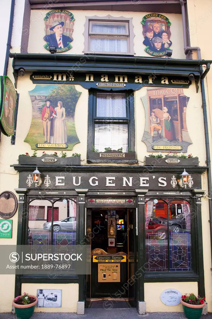 Pictures and stained glass windows on the front of eugene´s pub, ennistymon county clare ireland