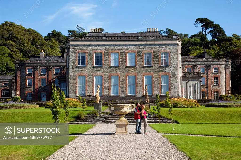 A couple stands on a path in the gardens at bantry house, bantry county cork ireland
