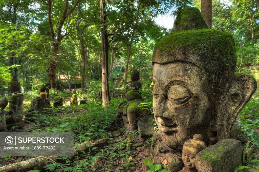 head statues in wat umong a famous forest temple, chiang mai thailand