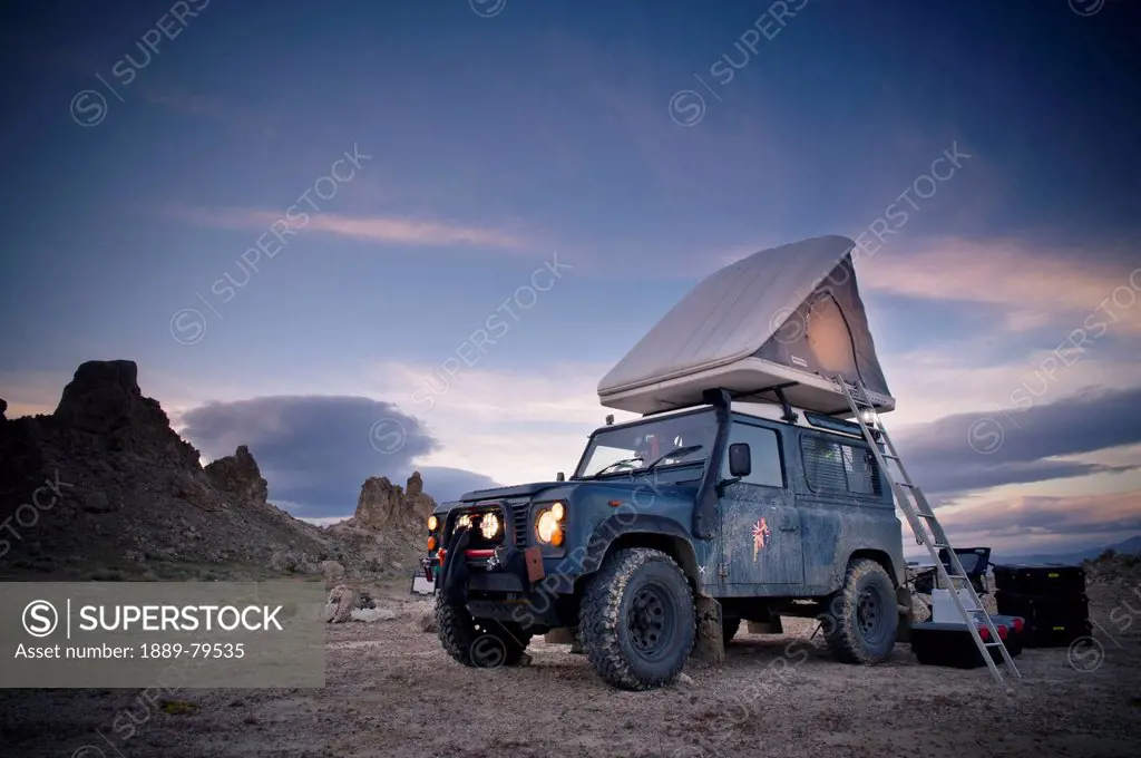 A 1983 Land Rover Defender Camped At Trona Pinacles, Trona California United States Of America