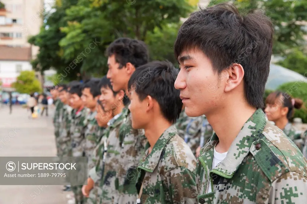 soldiers lined up in camouflage uniform, kunming yunnan china