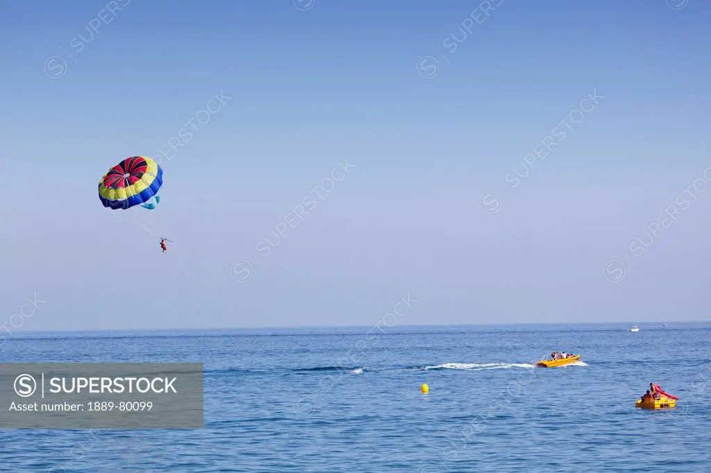 parasailing off bajondillo beach, torremolinos, malaga province, costa del sol, spain