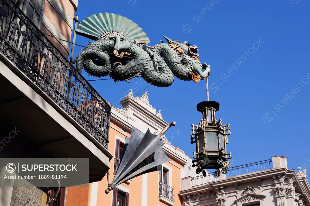 Chinese dragon and umbrella at casa dels paraigues on the ramblas, barcelona spain