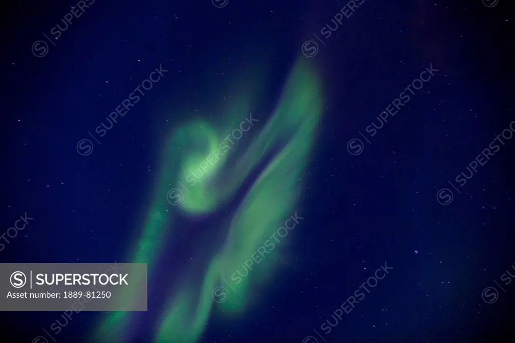 Aurora borealis shaped like an angel at wapusk national park, manitoba canada