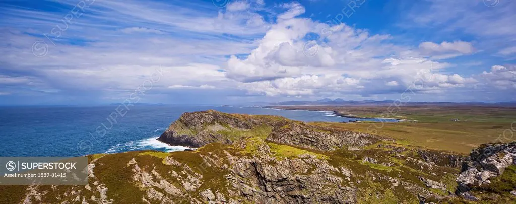 View from the sanaigmore cliffs on islay towards the paps of juray and colonsay, isle of islay southern hebrides scotland