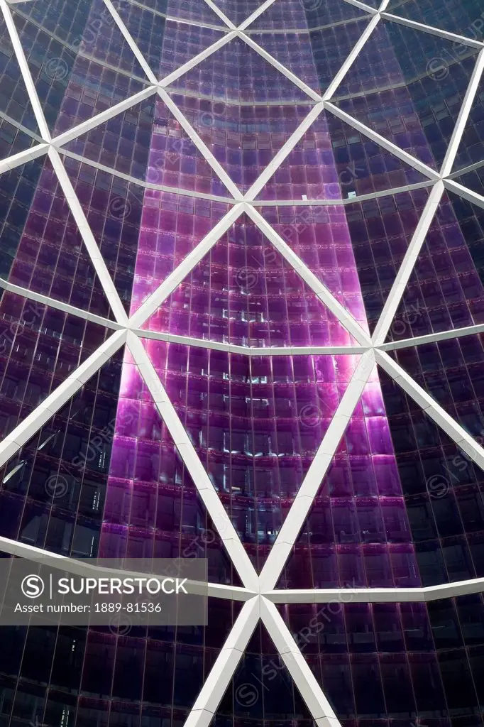 Detail of a glass building reflecting the sun with diamond design metal exterior, calgary alberta canada