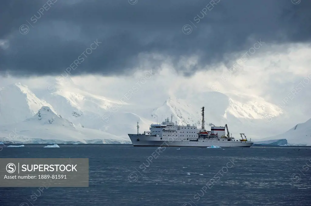 A large ship in the southern ocean along the coast, antarctica