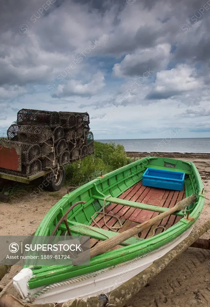 A boat and traps in a trailer on the beach, boulmer northumberland england