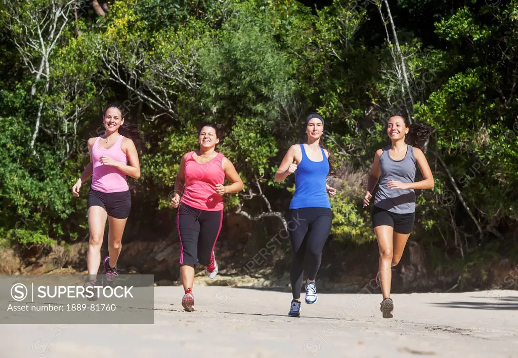 Four women running, gold coast queensland australia