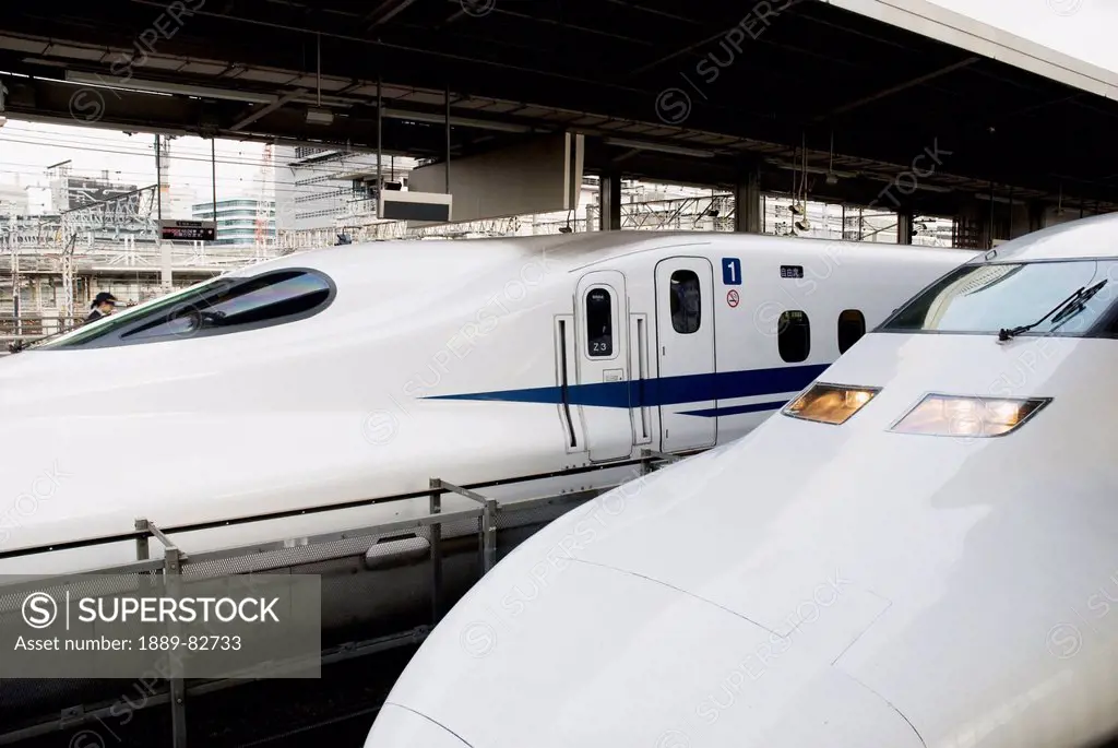 Two bullet train trains side by side in the station, tokyo, japan