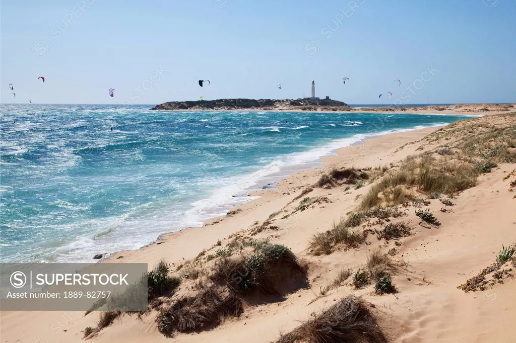 Kitesurfing off the coast of the beach at zahora, andalusia, spain