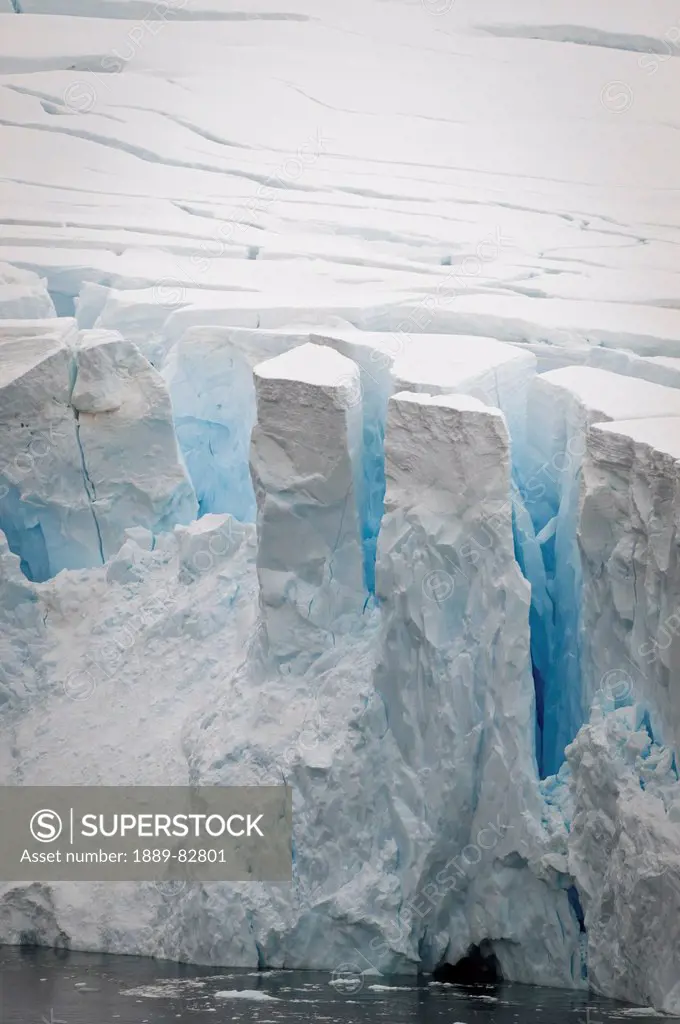 Cracks on the edge of an iceberg, antarctica