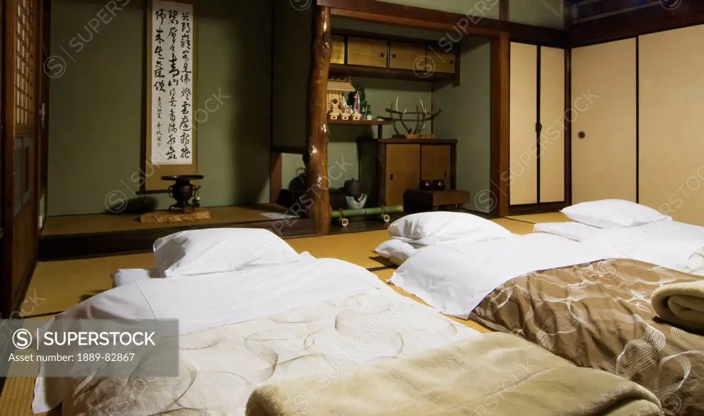 Three futons beds ready for the night in a traditional japanese home, nara, japan